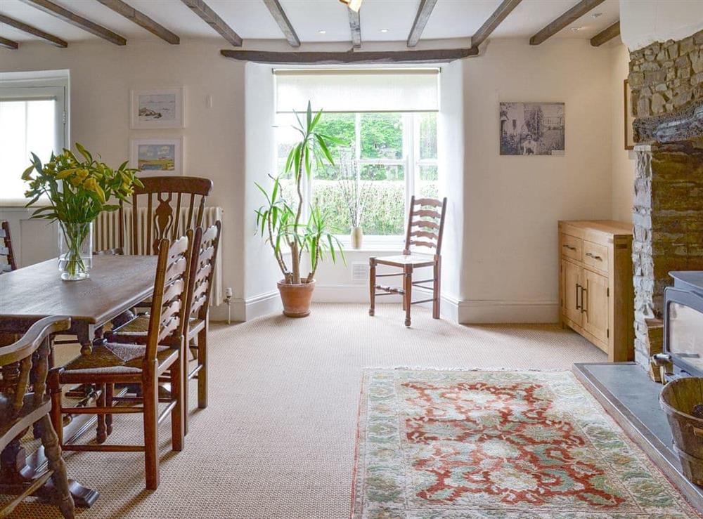 Spacious dining room with wood burner at Chaplands in Beaford, near Great Torrington, Devon