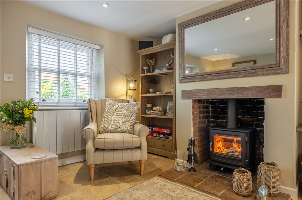 Cosy sitting room at Charnwood Cottage, Burnham Market