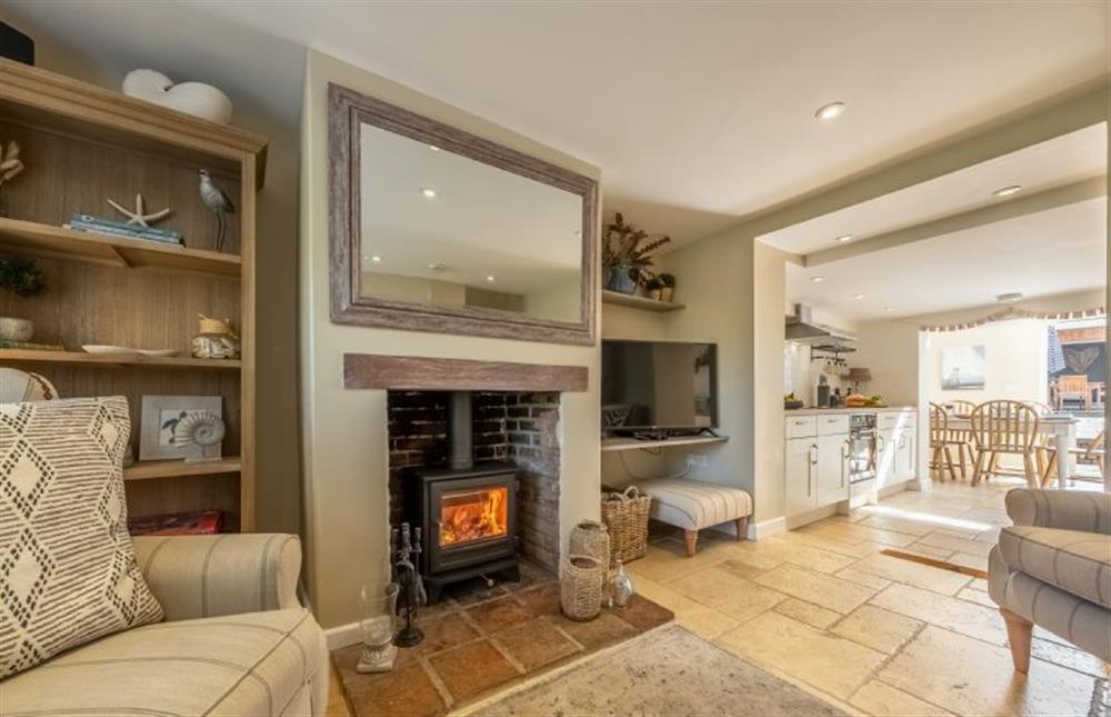 The sitting room boasts a wood burning stove at Charnwood Cottage, Burnham Market