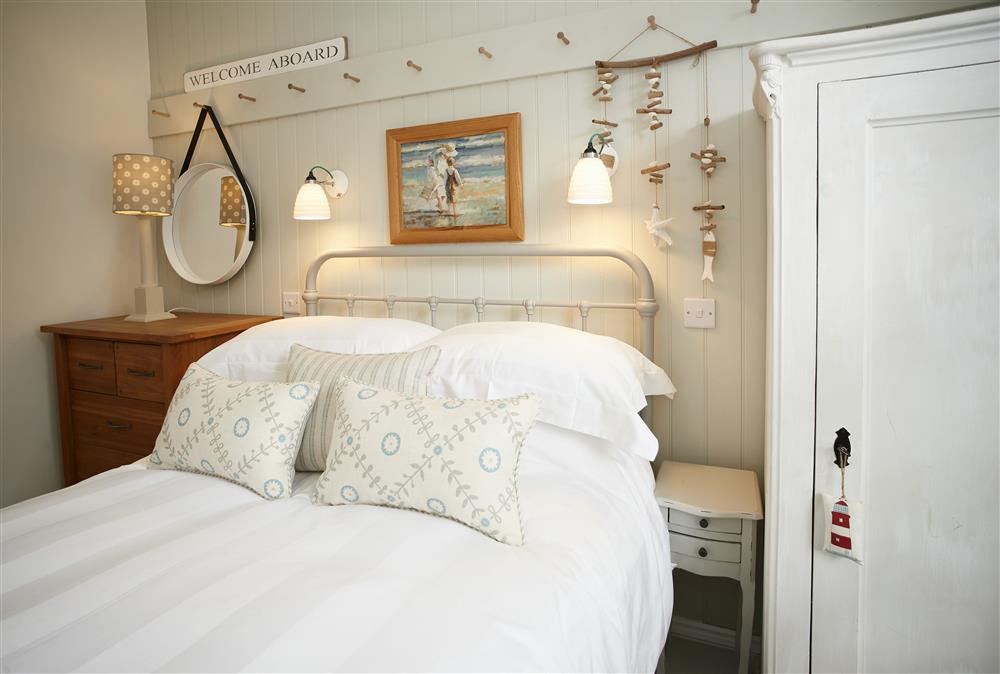 First floor: Bedroom with a 4\u00276 double bed featuring sumptuous bed linen   at Chart House, Tenby