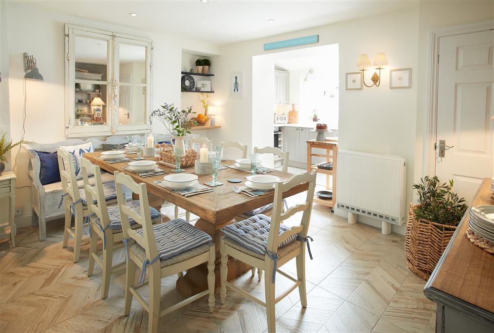 Ground floor: Dining room with open-plan kitchen and seating for ten guests (photo 2) at Chart House, Tenby