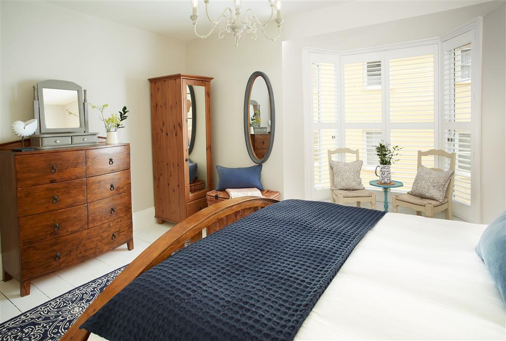 Second floor: Master bedroom with a 5\u0027 king-size bed  (photo 4) at Chart House, Tenby