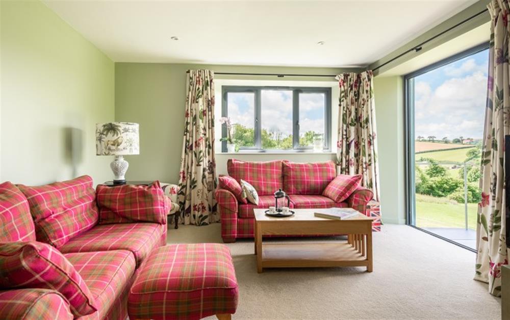 The spacious lounge with lovely views  at Chatwell Farm in Modbury