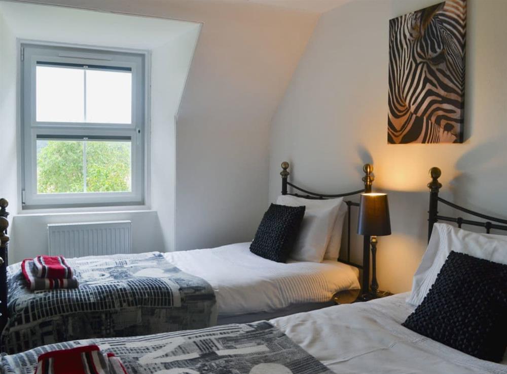 Twin bedroom at Checkers Cottage in Beauly, Inverness-Shire
