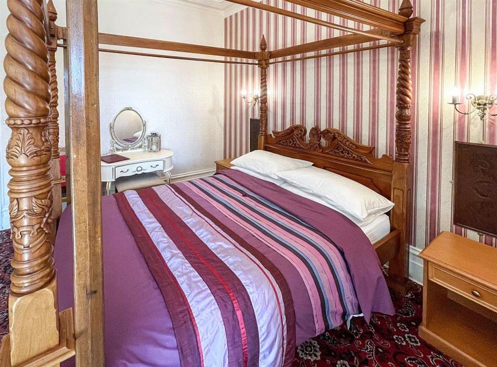 Four Poster bedroom (photo 2) at Cherry Blossom Inn in Blackpool, Lancashire