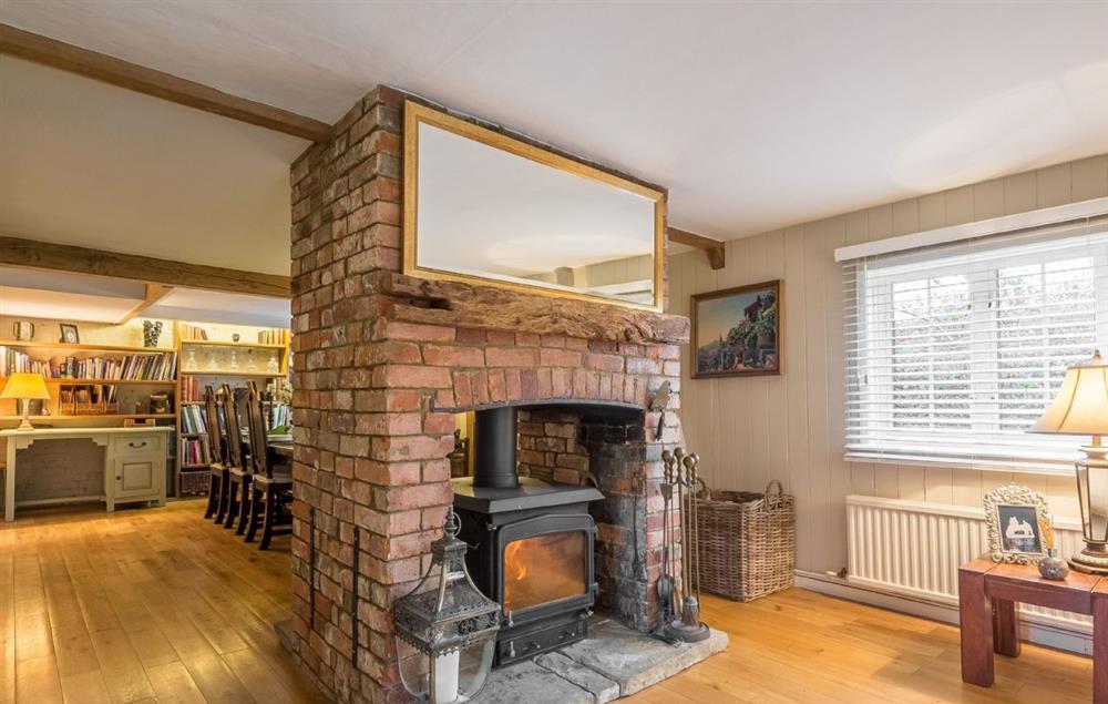 Cherry Cottage features an unusual double sided wood burning stove which keeps both the sitting area and dining area cosy