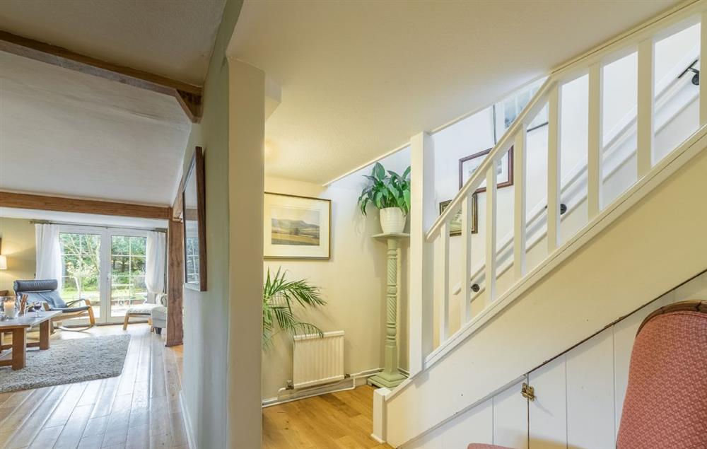 The staircase leads from the ground floor dining area to the first floor bedrooms at Cherry Cottage, Ripe