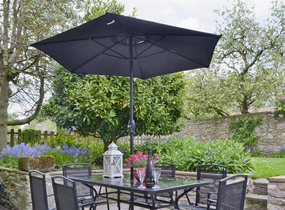 Outdoor eating area and mature garden at Cherry Tree Cottage in Bellerby, Wensleydale., North Yorkshire