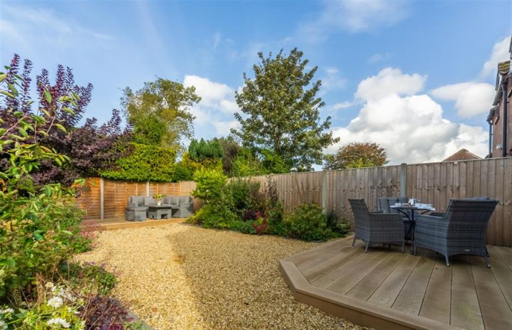 Fully-enclosed garden with two decked areas at Cherry Tree Cottage, Great Bircham near Kings Lynn