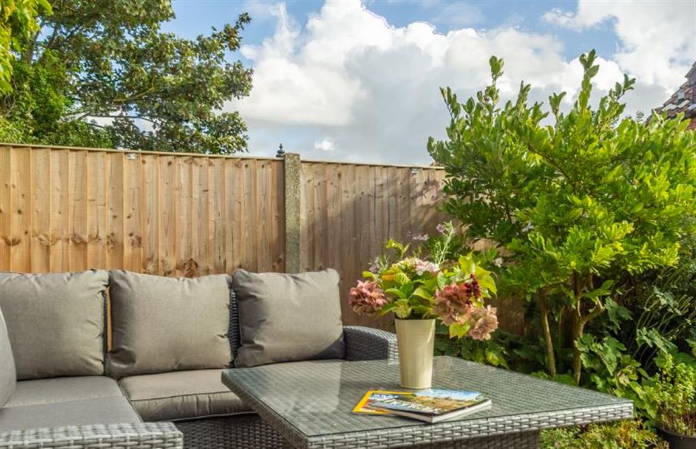 The garden has quality garden furniture at Cherry Tree Cottage, Great Bircham near Kings Lynn