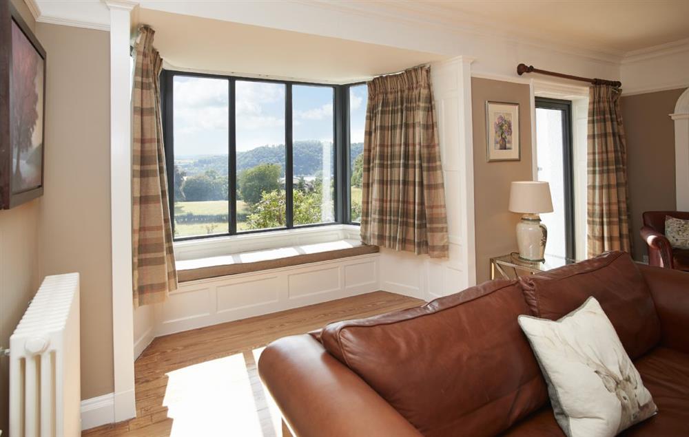Beautiful sitting room with patio doors and bay window with views across the Lake (photo 2) at Cherry Trees, Bowness-on-Windermere