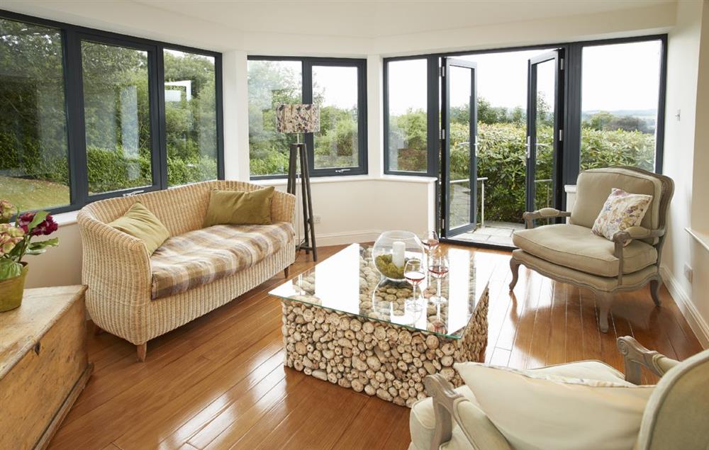 Conservatory with doors to the garden at Cherry Trees, Bowness-on-Windermere