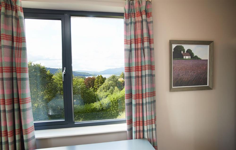 Fifth bedroom with triple aspect views, flat screen TV and en-suite shower room (photo 2) at Cherry Trees, Bowness-on-Windermere