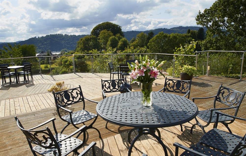 Large decking area with seating and outside dining areas (photo 2) at Cherry Trees, Bowness-on-Windermere