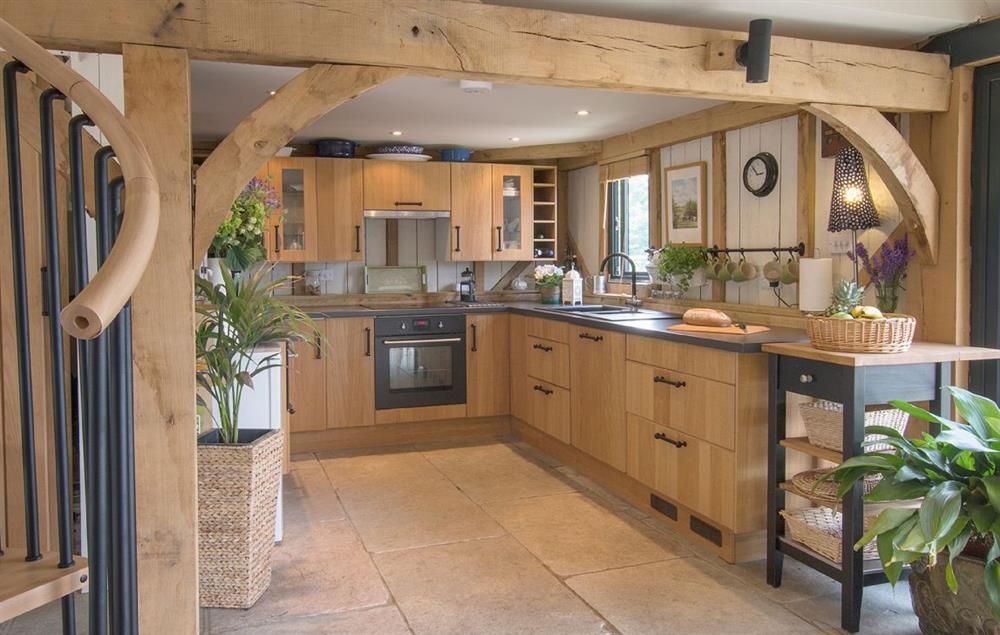 Open plan kitchen.  Spiral staircase (please note the upstairs accommodation is not available to guests)