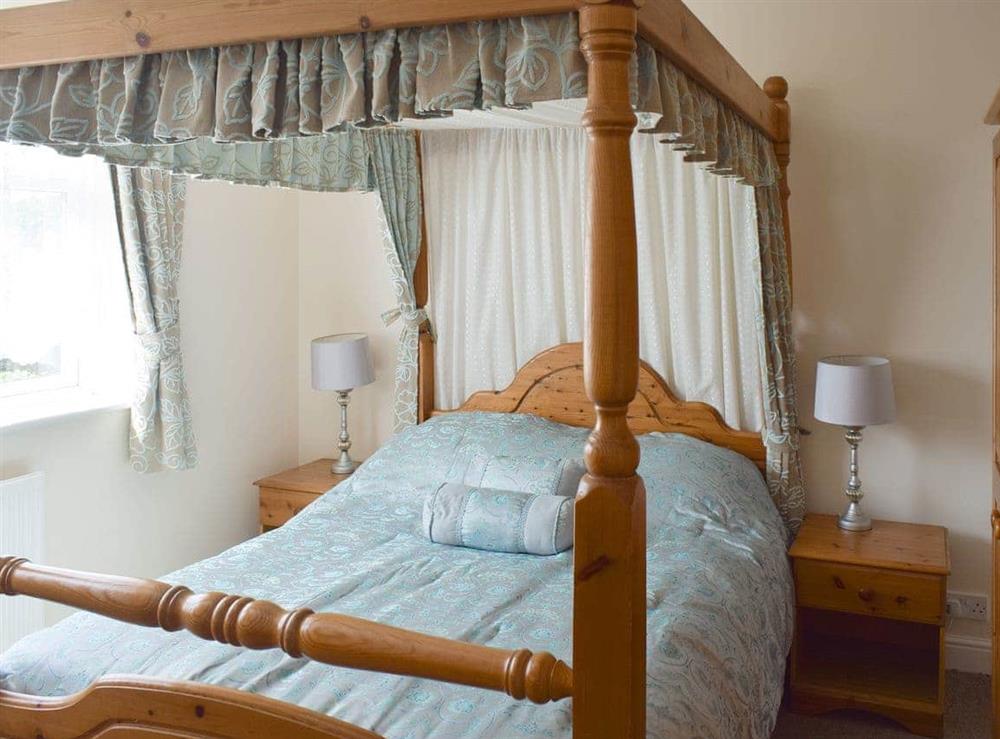Comfortable four poster bedroom at Cherrytree Cottage in Loftus, Saltburn-by-the-Sea, Cleveland