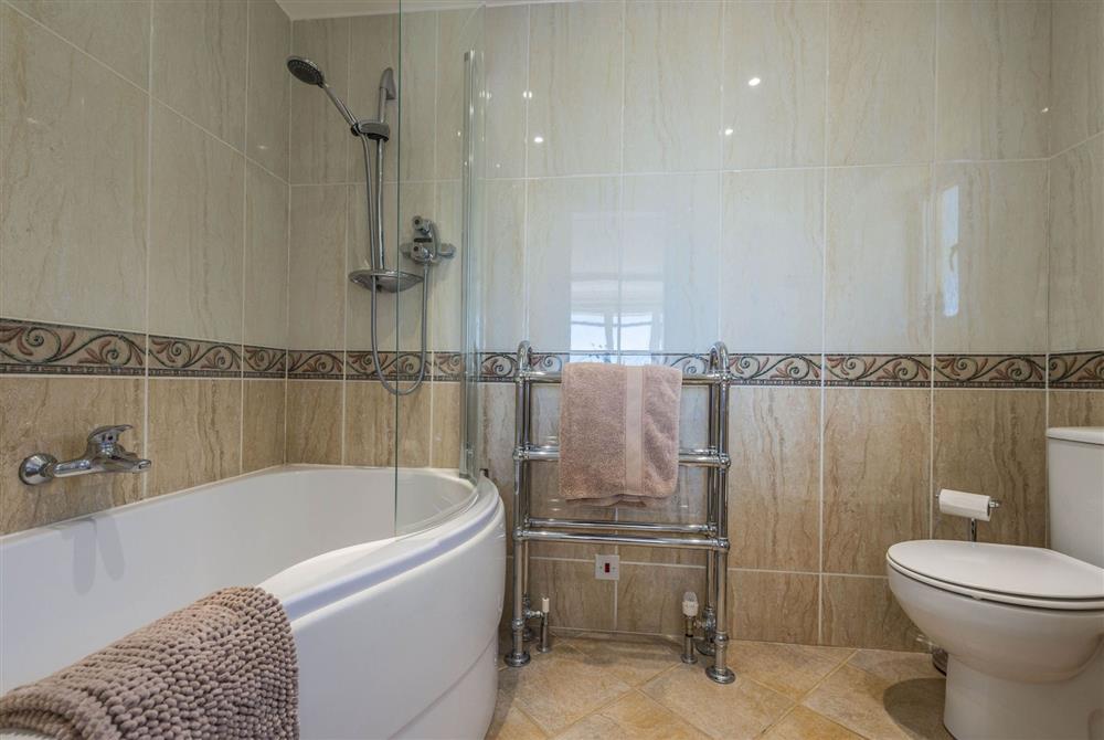 En-suite bathroom with shower at Chesil Watch, Abbotsbury