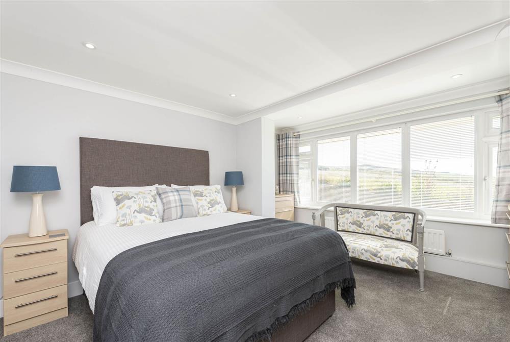 Master bedroom with en-suite bathroom with shower (photo 2) at Chesil Watch, Abbotsbury
