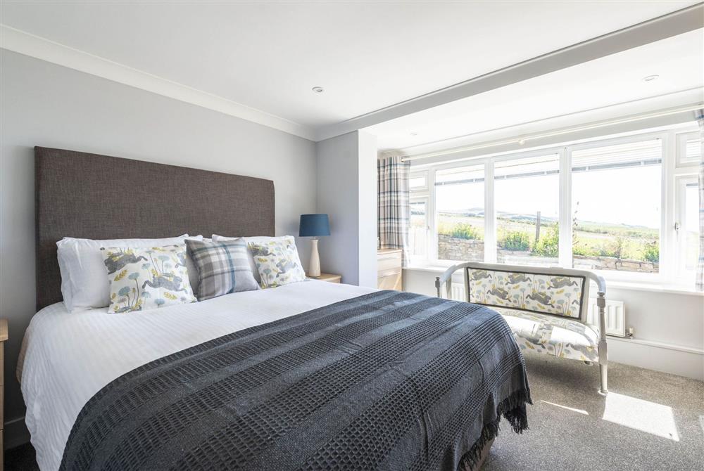 Master bedroom with en-suite bathroom with shower at Chesil Watch, Abbotsbury