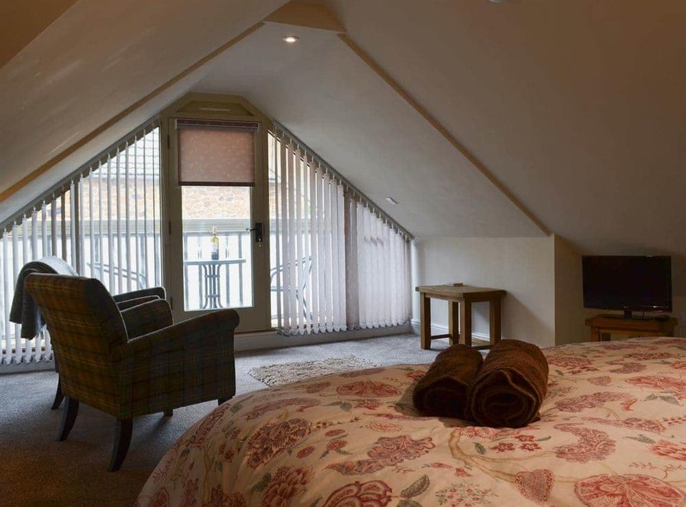 Spacious, galleried double bedroom (photo 2) at The Hayloft, 