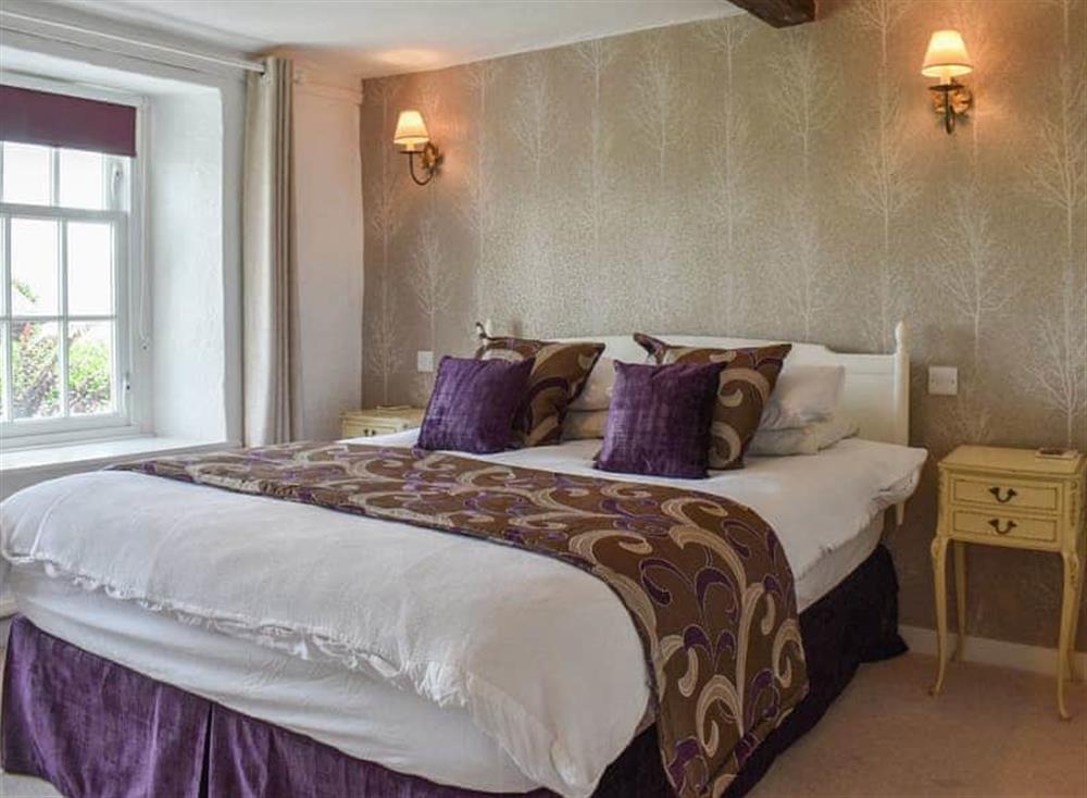 Bedroom with kingsize bed at Chestnut Cottage in Grange-over-Sands, Cumbria