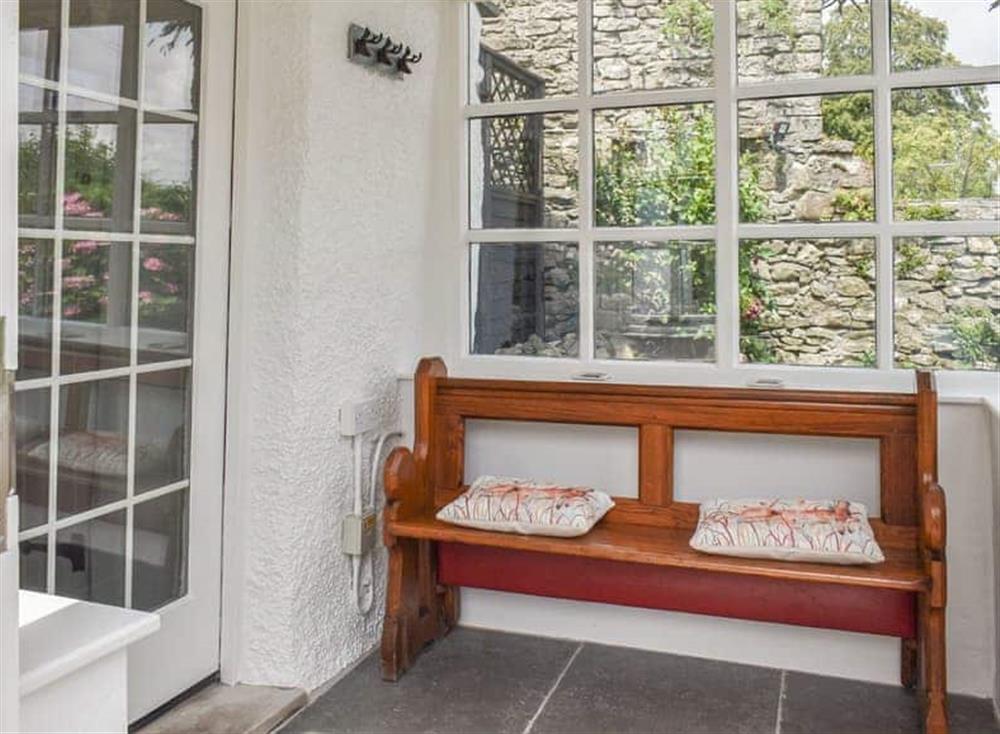 Entrance porch with seating at Chestnut Cottage in Grange-over-Sands, Cumbria