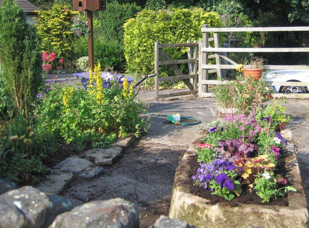 Well-maintained garden areas at Chestnut Cottage in Old Brampton, near Bakewell, Derbyshire