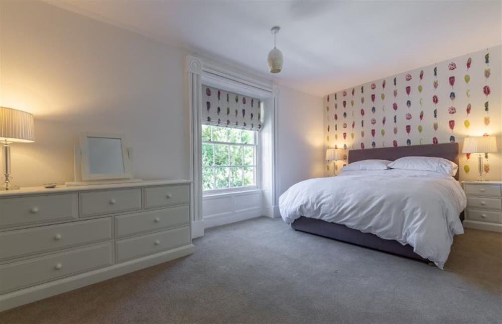 First floor: Bedroom two features a super-king size bed with views to the front ... at Chestnut Cottage, Thornham near Hunstanton