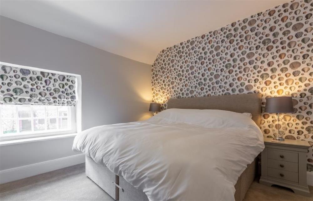 First floor: The master bedroom features a king-size bed ... at Chestnut Cottage, Thornham near Hunstanton