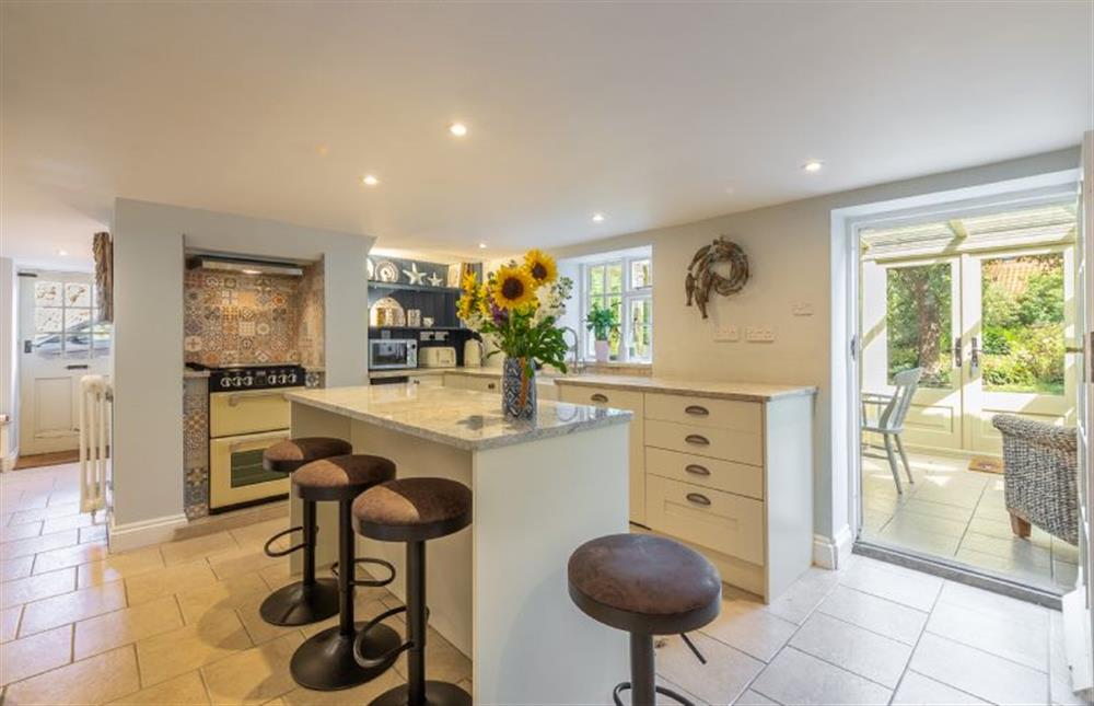 Ground floor: Kitchen with central island/breakfast bar at Chestnut Cottage, Thornham near Hunstanton