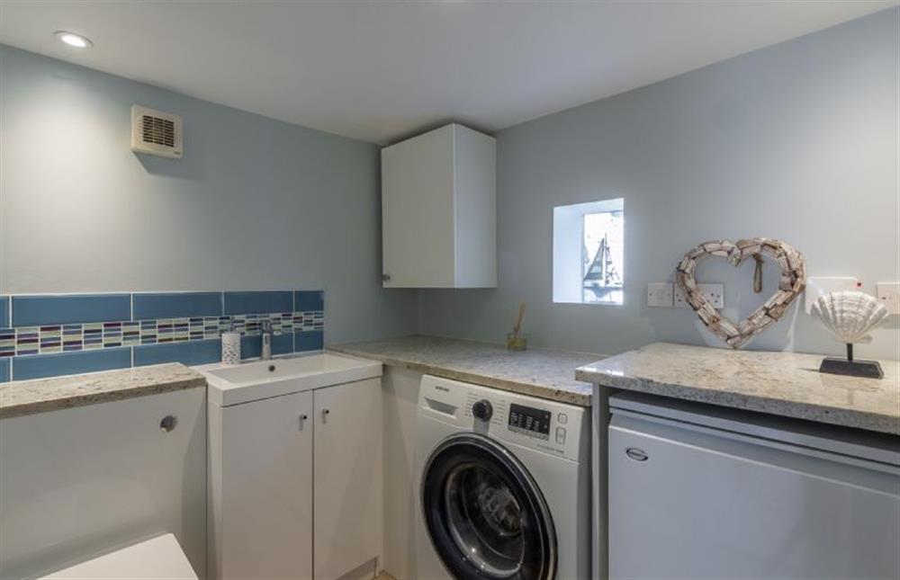 Ground floor: Utility room with washing machine and WC