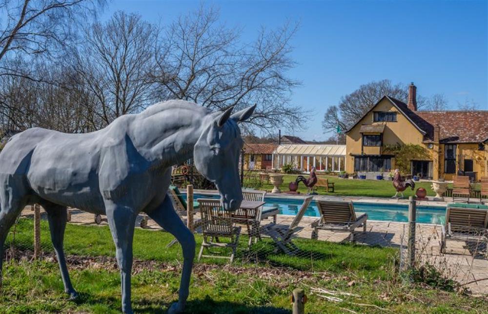 Follow the sculptures around the landscaped gardens at Chestnut Cottage, Westleton