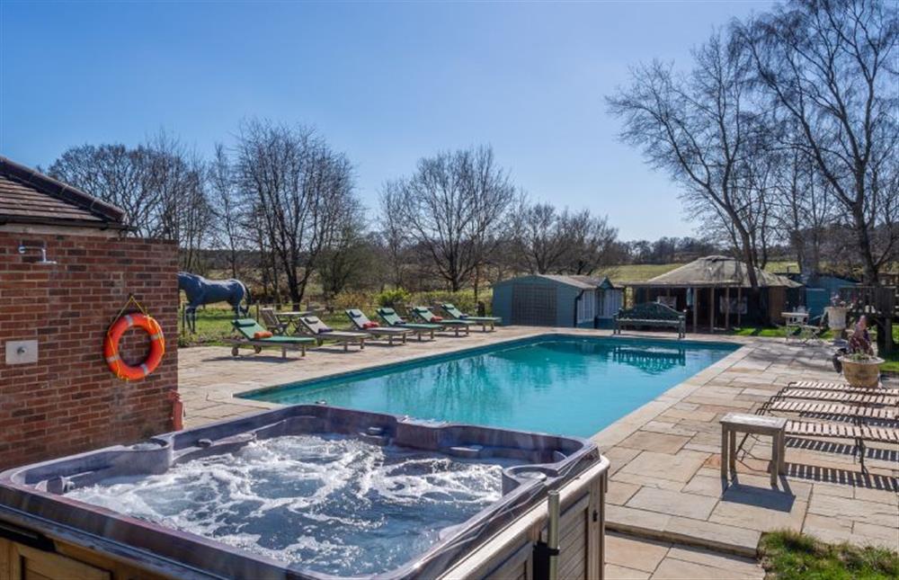 Guests can use the hot tub and swimming pool at Chestnut Cottage, Westleton