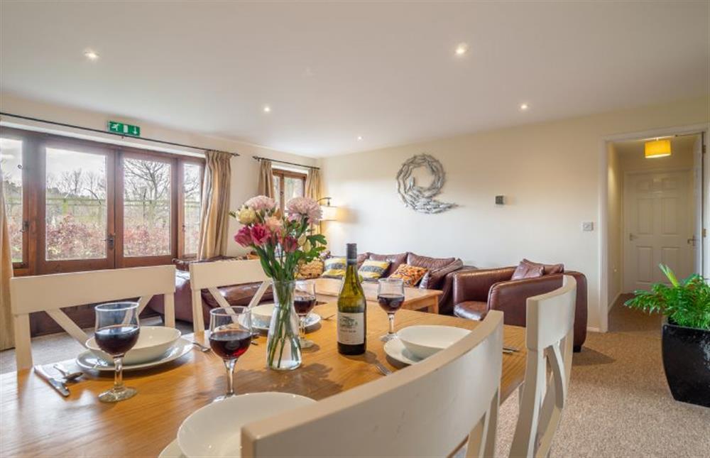 Open-plan sitting and dining room at Chestnut Cottage, Westleton