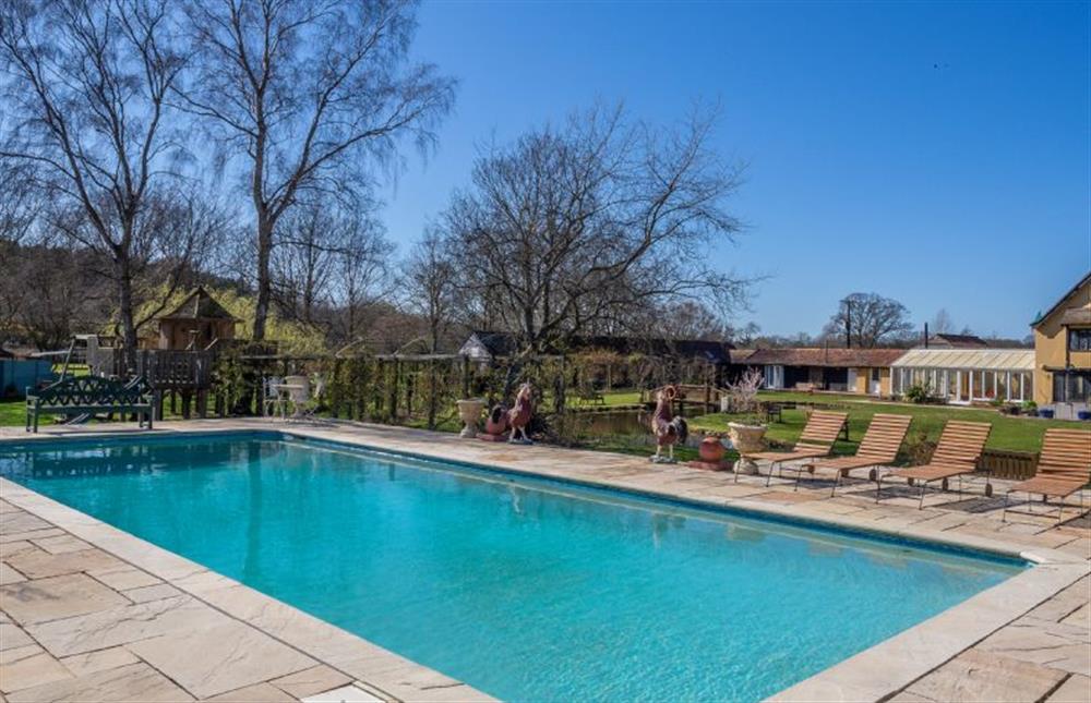 Shared access of an outdoor swimming pool at Chestnut Cottage, Westleton