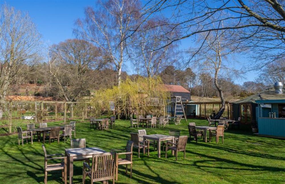 There is a restaurant on-site with ample seating outside for al fresco dining at Chestnut Cottage, Westleton