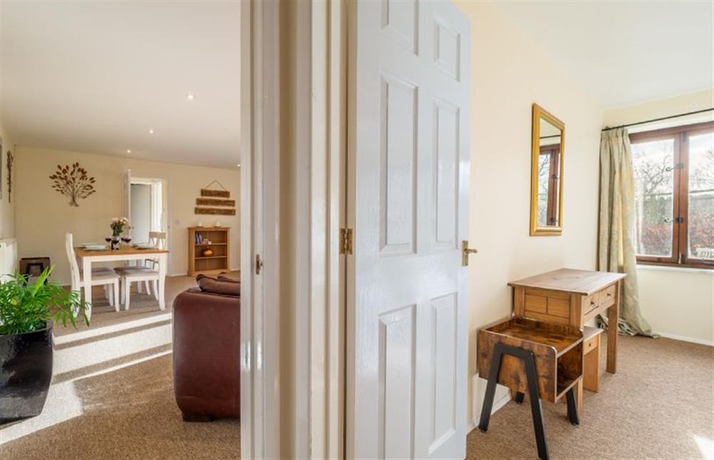 Views through to the open-plan living space and master bedroom at Chestnut Cottage, Westleton