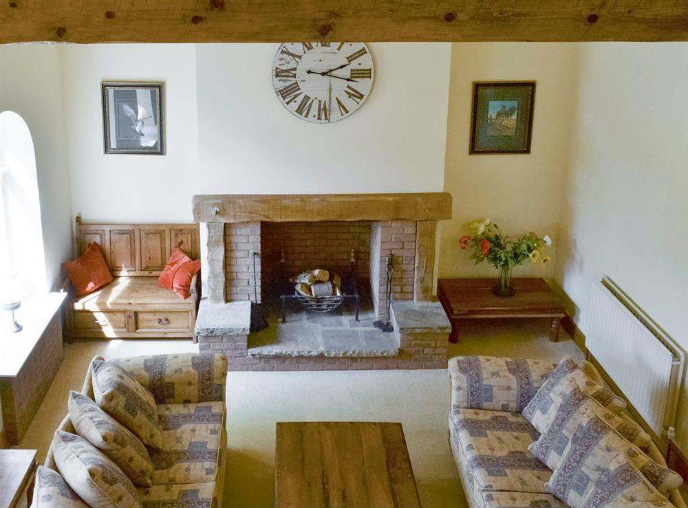 Lovely living room with feature fireplace at Binbrook House Mews, 