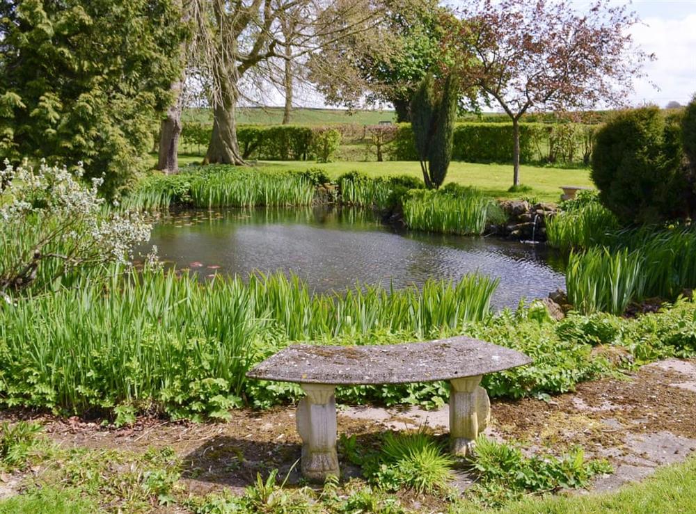 Shared facilities – Tranquil lakeside seating at Binbrook House Mews, 