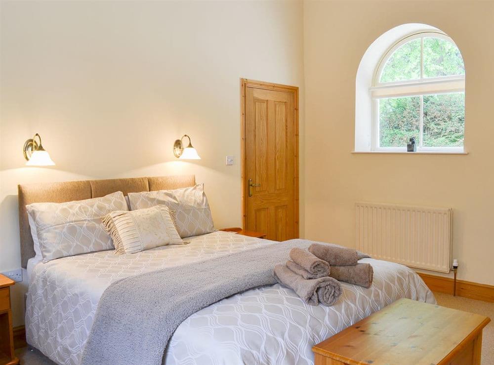 Warm and welcoming double bedroom at Binbrook House Mews, 
