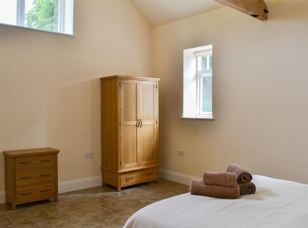 Warm and welcoming double bedroom at Chestnut Farm Mews, 