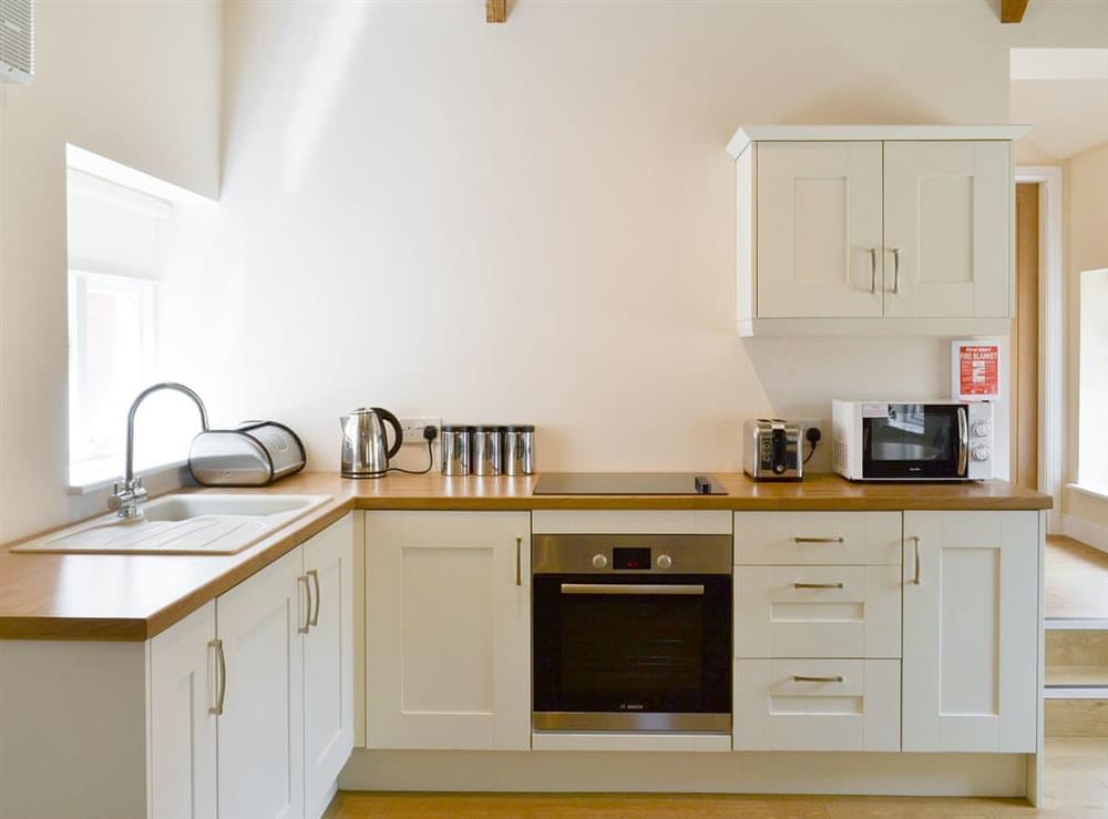 Well-equipped fitted kitchen at Mays Mews, 