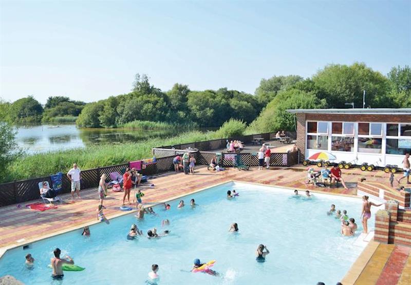 Outdoor pool at Chichester Lakeside Holiday Park in Chichester, Sussex