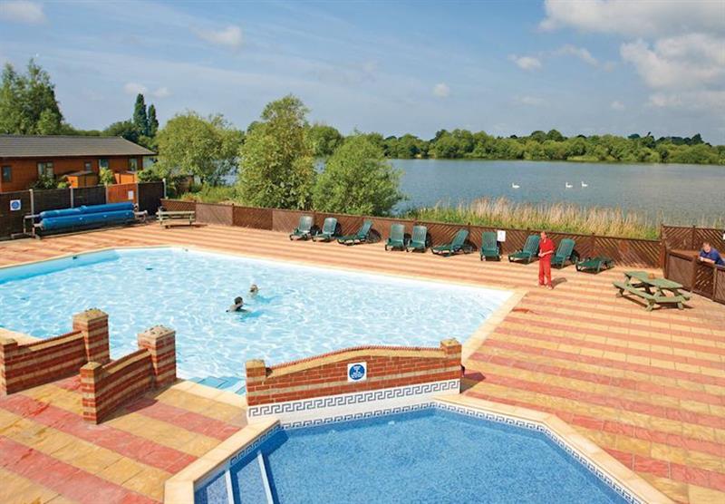 Outdoor swimming pool at Chichester Lakeside Holiday Park in Chichester, Sussex