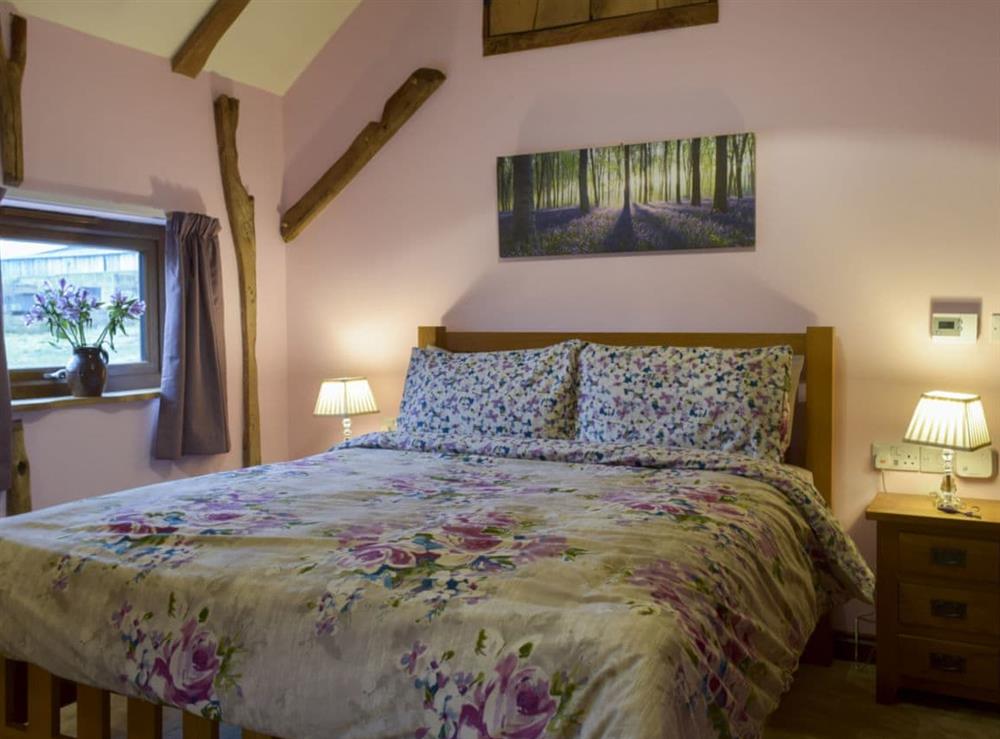 Large bedroom with kingsize bed at Chick Hatch Barn in Carlton, near Saxmundham, Suffolk