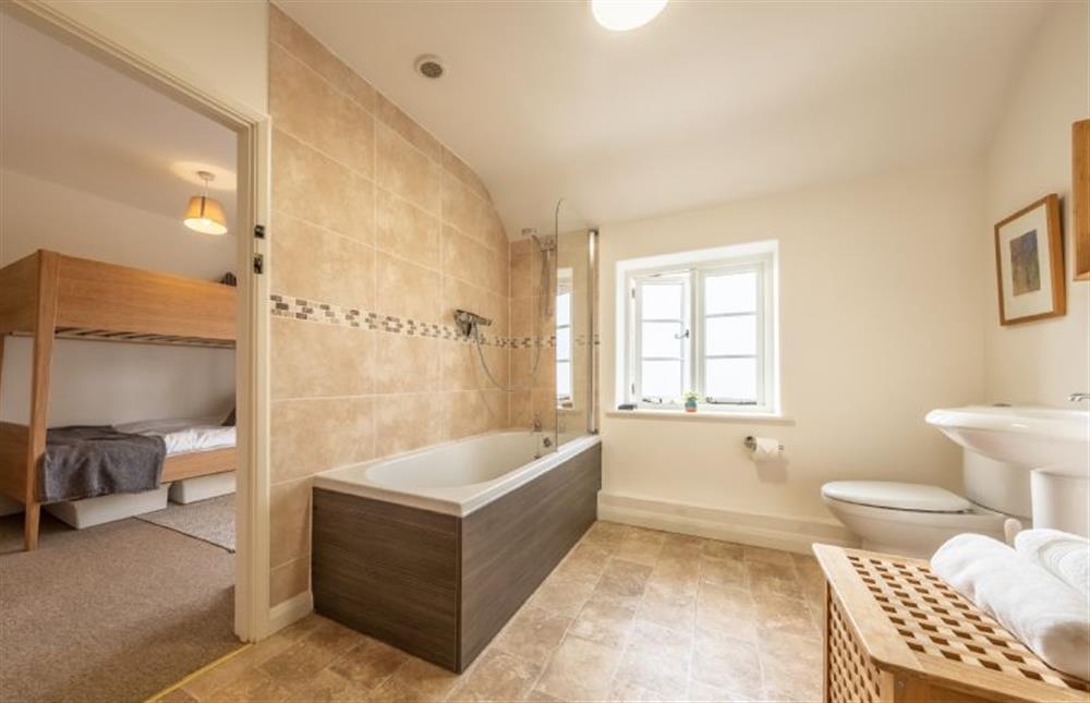 First floor: The family bathroom with door to the bunk bedroom at Chiffchaff Cottage, West Raynham near Fakenham