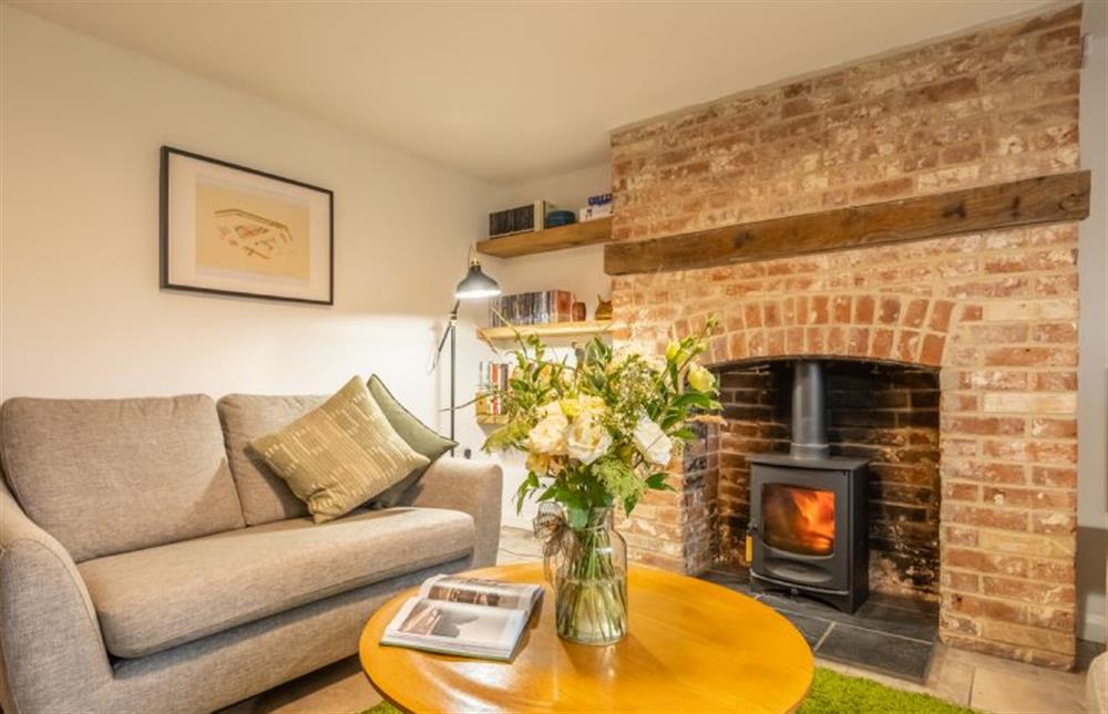 Ground floor: Cosy wood burning stove in the sitting room at Chiffchaff Cottage, West Raynham near Fakenham