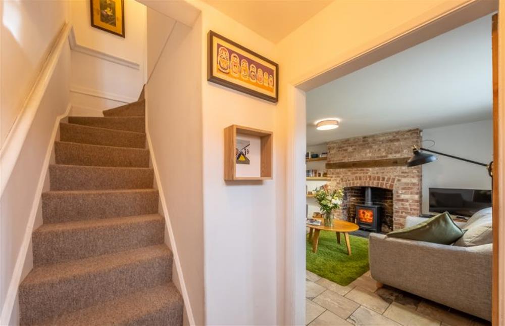 Ground floor: Sitting room and stairs at Chiffchaff Cottage, West Raynham near Fakenham