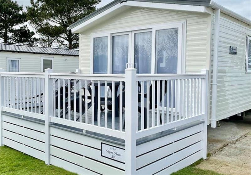 Decked area outside the Chapel Porth 3 at Chiverton Holiday Park in Blackwater, St Agnes