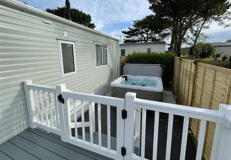 Hot tub in the Perranporth VIP 2 at Chiverton Holiday Park in Blackwater, St Agnes